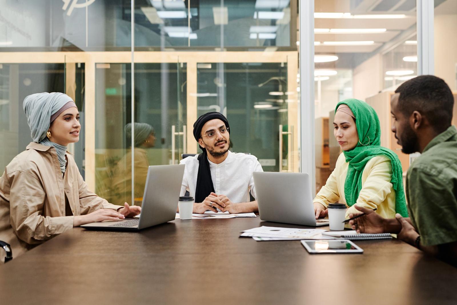 A team around a table with laptops